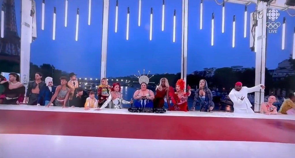 Men in drag portraying Jesus and disciples at the Last Supper during the opening event of the Olympic Games